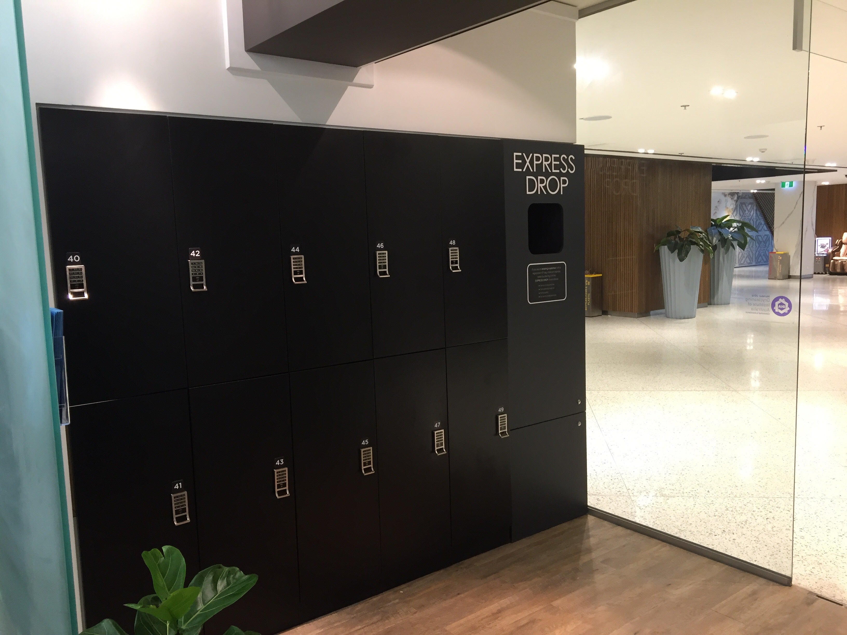 Laundry Warehouse 24/7 retail storefront with a bank of smart laundry lockers